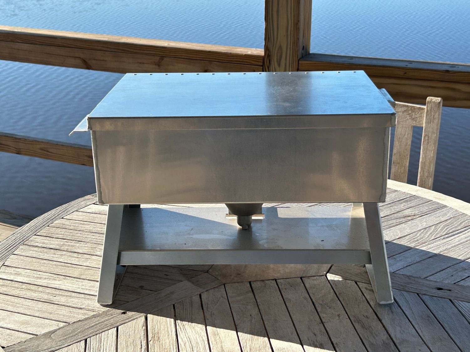 Premium aluminum 27-quart cooker "The Chuck" on outdoor table.