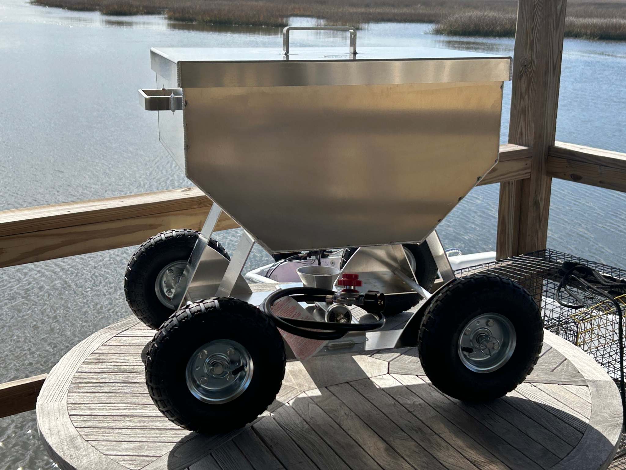 The Classic 4x4 seafood cooker made of marine grade aluminum with handles, perfect for steams and boils.