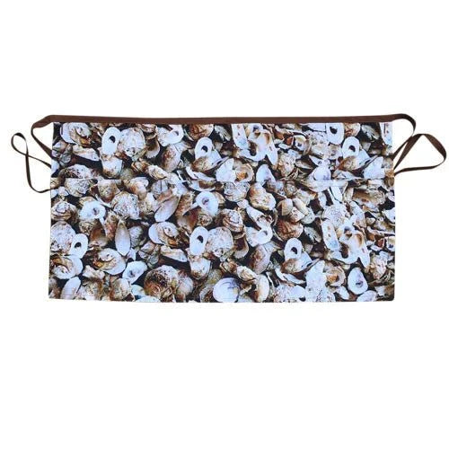 Charleston Oyster apron with oyster shell design and pockets.