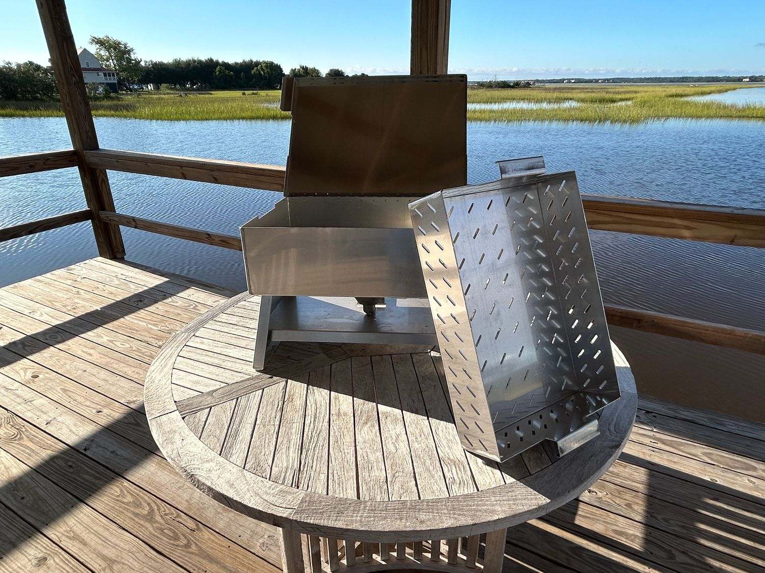 Outdoor kitchen setup featuring The Chuck, a 27-quart premium aluminum cooker ideal for seafood steaming and boiling.