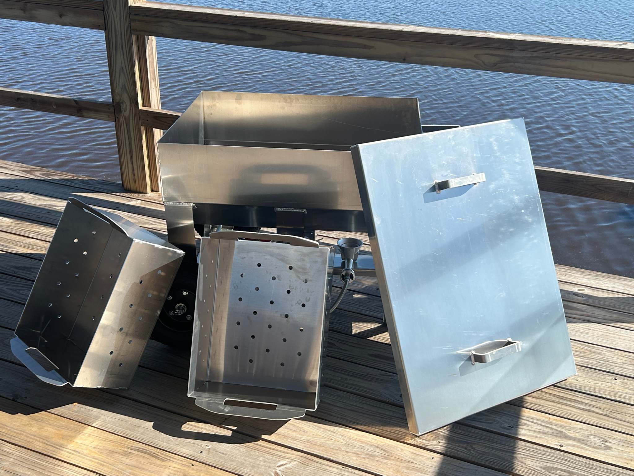 marine grade aluminum 70-quart wheeled seafood cooker with double baskets for steaming shellfish by the water